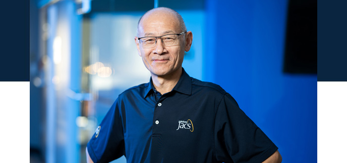 Dr. Chang Gang Zhang, VP of technology at JACS standing for a portrait headshot at office headquarters